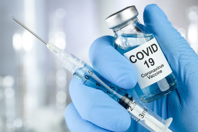 Healthcare cure concept with a hand in blue medical gloves holdi