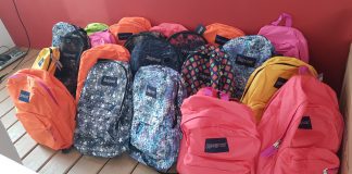 Aruba One Happy Island Lions Club y Delta Aruba Leo Club cu donacion di 65 tas pa school