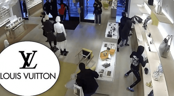 Grupo di 14 hoben a drenta tienda di Louis Vuitton y horta mas di 100 mil dollar na mercancia