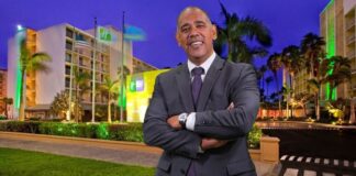 Lowenstein di Holiday Inn a duna Benny 50 mil florin y fiesta gratis pa yiu muher a cambio di tereno