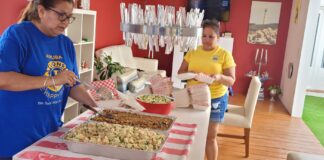 Aruba One Happy Island Lions Club a parti lunch pa famianan den necesidad y persona nan ambulantenan na Oranjestad y San Nicolas