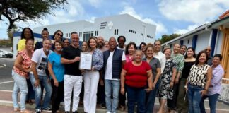 Departamento di Asunto Social a ricibi su certificacion oficial di ISO 9001